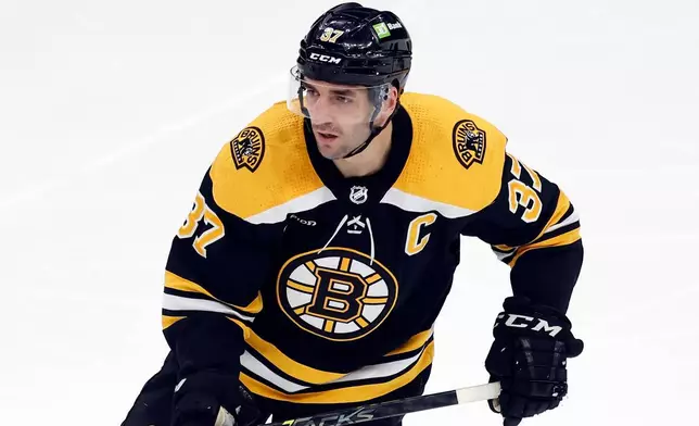 FILE - Boston Bruins' Patrice Bergeron plays against the Tampa Bay Lightning during the second period of an NHL hockey game, March 25, 2023, in Boston. (AP Photo/Michael Dwyer, File)