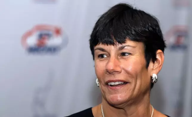 FILE - Cindy Curley addresses the media before her induction into the United States Hockey Hall of Fame in Detroit, Dec. 2, 2013. (AP Photo/Carlos Osorio, File)