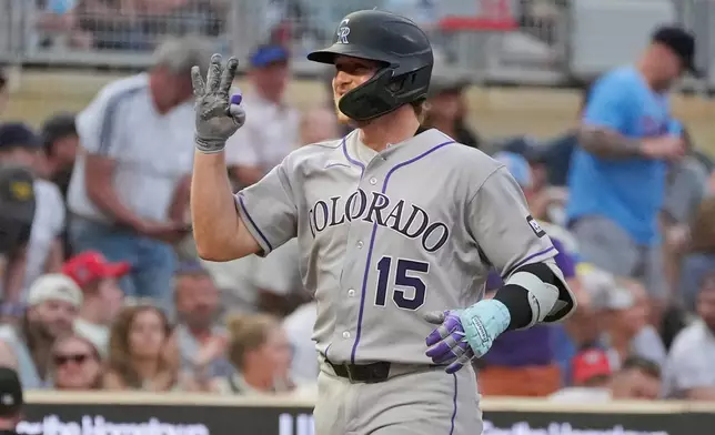 Colorado Rockies' Hunter Goodman runs the bases on his three-run home run against the Minnesota Twins in the seventh inning of a baseball game Saturday, June 27, 2026, in Minneapolis. (AP Photo/Bruce Kluckhohn)