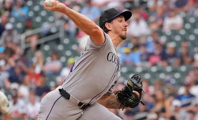 Colorado Rockies starting pitcher Michael Lorenzen throws to the Minnesota Twins in the first inning of a baseball game Saturday, June 27, 2026, in Minneapolis. (AP Photo/Bruce Kluckhohn)