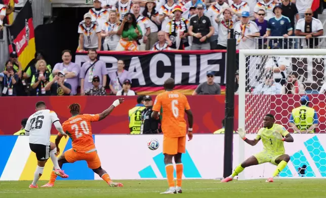 Germany's Deniz Undav (26) scores their second goal during the World Cup Group E soccer match between Germany and Ivory Coast in Toronto, Saturday, June 20, 2026. (Nathan Denette/The Canadian Press via AP)