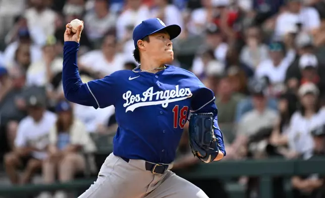 Los Angeles Dodgers pitcher Yoshinobu Yamamoto (18) delivers during the fifth inning of a baseball game against the Chicago White Sox, Saturday, June 13, 2026, in Chicago. (AP Photo/Matt Marton)