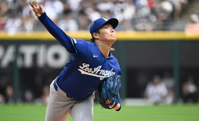 Los Angeles Dodgers pitcher Yoshinobu Yamamoto, of Japan, delivers during the first inning of a baseball game against the Chicago White Sox, Saturday, June 13, 2026, in Chicago. (AP Photo/Matt Marton)