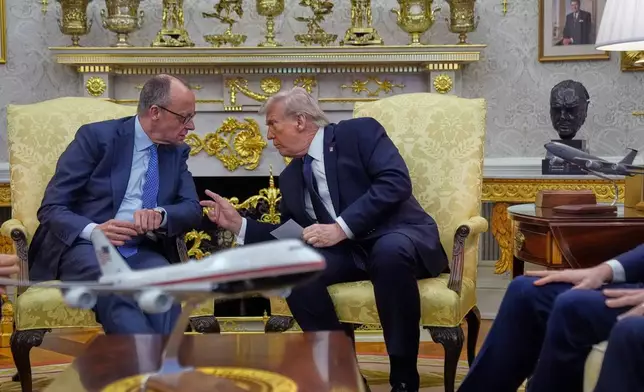 FILE - President Donald Trump meets with German Chancellor Friedrich Merz in the Oval Office at the White House, March 3, 2026, in Washington. (AP Photo/Mark Schiefelbein, File)