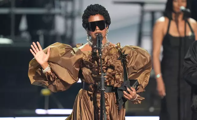 Lauryn Hill accepts the living legend icon award during the BET Awards on Sunday, June 28, 2026, at the Peacock Theater in Los Angeles. (AP Photo/John Locher)