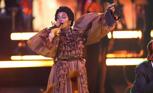 Lauryn Hill accepts the living legend icon award during the BET Awards on Sunday, June 28, 2026, at the Peacock Theater in Los Angeles. (AP Photo/John Locher)