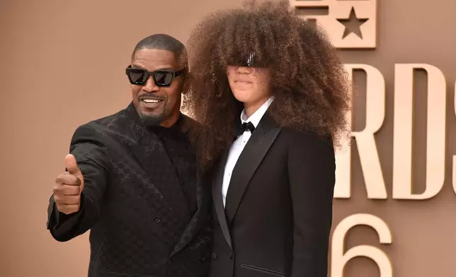 Jamie Foxx, left, and Anelise Bishop arrive at the BET Awards on Sunday, June 28, 2026, at the Peacock Theater in Los Angeles. (Photo by Richard Shotwell/Invision/AP)