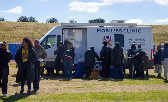 Secunda residents receive medical services at a mobile clinic during the rollout of Lenacapavir in Secunda, South Africa, Friday, June 5, 2026. (AP Photo/Kayleen Morgan)