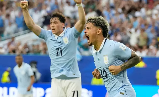 Uruguay's Maxi Araujo celebrates scoring his side's opening goal against Saudi Arabia during a World Cup Group H soccer match in Miami Gardens, Fla., Monday, June 15, 2026. (AP Photo/Lynne Sladky)