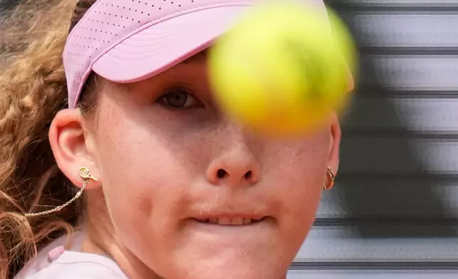 Russia's Mirra Andreeva returns to Ukraine's Marta Kostyuk during the semifinal tennis match at the French Open in Paris, Thursday, June 4, 2026. (AP Photo/Christophe Ena)