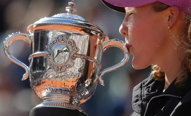 Russia's Mirra Andreeva poses with the trophy after winning the final women's tennis match against Poland's Maja Chwalinska at the French Open in Paris, Saturday, June 6, 2026. (AP Photo/Aurelien Morissard)