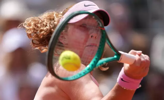 Russia's Mirra Andreeva returns during the final tennis match against Poland's Maja Chwalinska at the French Open in Paris, Saturday, June 6, 2026. (AP Photo/Thibault Camus)