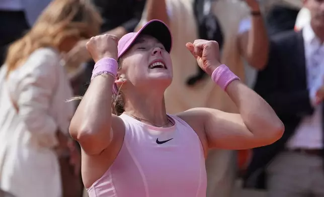 Russia's Mirra Andreeva ewacts after winning the final tennis match against Poland's Maja Chwalinska at the French Open in Paris, Saturday, June 6, 2026. (AP Photo/Thibault Camus)