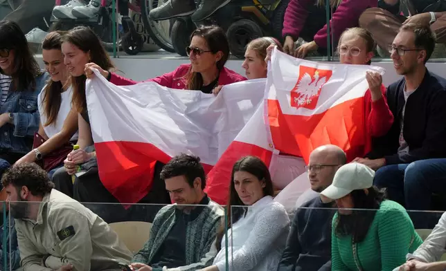 Polish fans cheer during the final tennis match between Poland's Maja Chwalinska and Russia's Mirra Andreeva at the French Open in Paris, Saturday, June 6, 2026. (AP Photo/Aurelien Morissard)