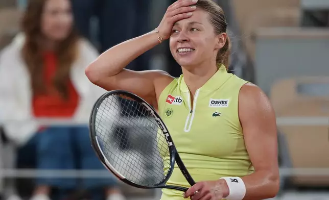 Poland's Maja Chwalinska react after winning during the semifinal tennis match against Russia's Diana Shnaider at the French Open in Paris, Thursday, June 4, 2026. (AP Photo/Thibault Camus)