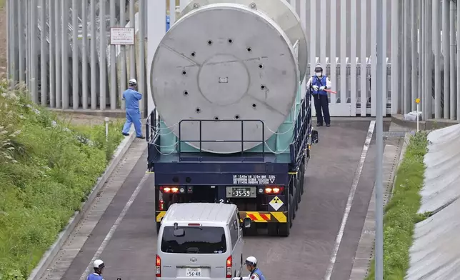 A cask containing spent fuel from Kashiwazaki-Kariwa is transported to an interim storage in Mutsu, Aomori, northern Japan on Sept. 26, 2024. (Kyodo News via AP)