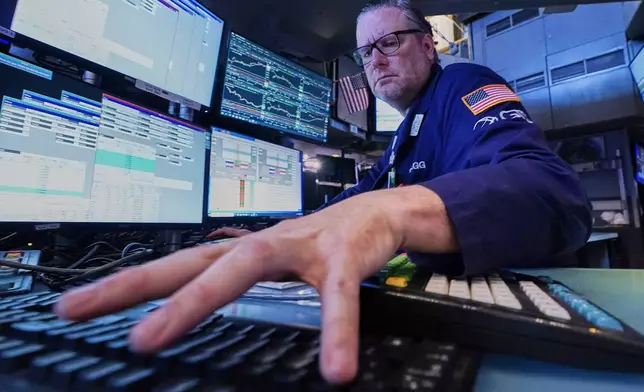 Specialist Gregg Maloney works at his post on the floor of the New York Stock Exchange, Monday, June 1, 2026. (AP Photo/Richard Drew)