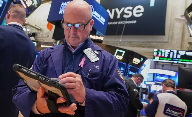 Trader Patrick Casey works on the floor of the New York Stock Exchange, Wednesday, June 3, 2026. (AP Photo/Richard Drew)