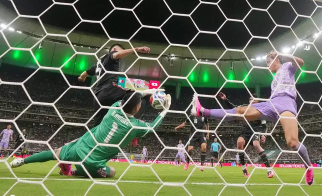 Mexico goalkeeper Raul Rangel (1) makes a save on the goal line during the World Cup Group A soccer match between Mexico and South Korea in Zapopan, near Guadalajara, Mexico, Thursday, June 18, 2026. (AP Photo/Fernando Llano)