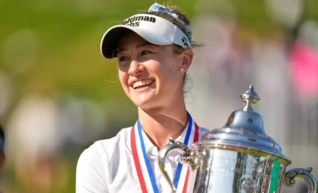 Nelly Korda holds the trophy after winning the U.S. Women's Open golf tournament Sunday, June 7, 2026, in the Pacific Palisades area of Los Angeles. (AP Photo/Ashley Landis)