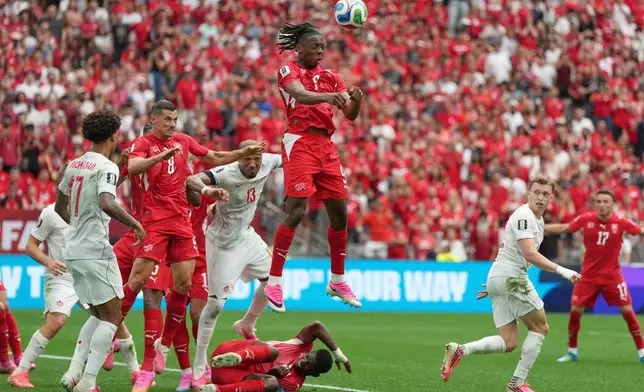 Switzerland's Johan Manzambi (9) heads the ball during the World Cup Group B soccer match between Switzerland and Canada in Vancouver, British Columbia, Wednesday, June 24, 2026. (AP Photo/Abbie Parr)