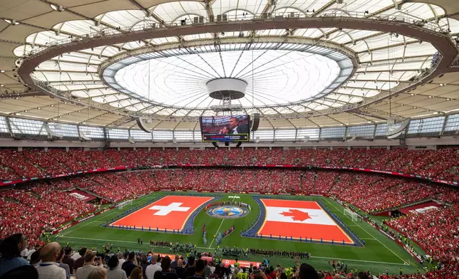 National flags are displayed before the World Cup Group B soccer match between Switzerland and Canada in Vancouver, British Columbia, Wednesday, June 24, 2026. (Timothy Matwey/The Canadian Press via AP)