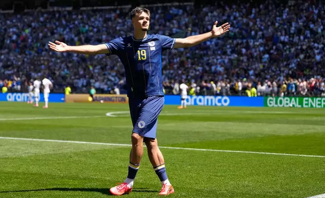 Bosnia's Kerim Alajbegovic celebrates after scoring his side's opening goal during the World Cup Group B soccer match against Qatar in Seattle, Wednesday, June 24, 2026. (AP Photo/Lindsey Wasson)