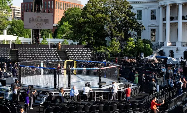 Members of the media view the arena for the UFC Freedom 250 fights on the South Lawn of the White House, Thursday, June 11, 2026, in Washington. (AP Photo/Alex Brandon)
