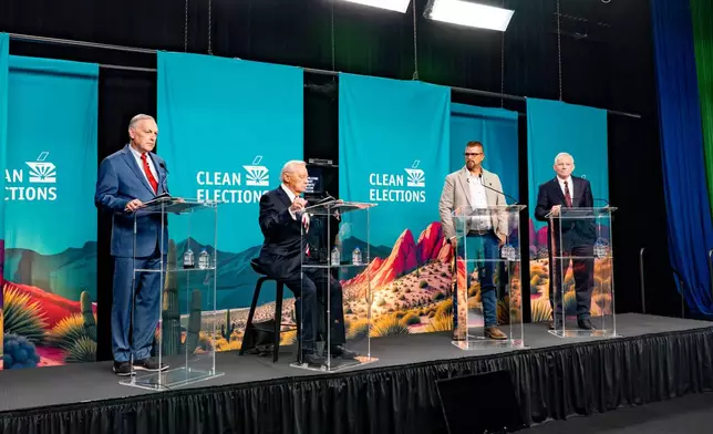 Rep. Andy Biggs, R-Ariz., left, Ken Miceli, second from left, Scott Neely and Rep. David Schweikert, R-Ariz., right, stand on the stage in the 2026 AZ Clean Elections Republican governor primary debate, Wednesday, June 17, 2026, in Scottsdale, Ariz. (Diannie Chavez/The Arizona Republic via AP, Pool)