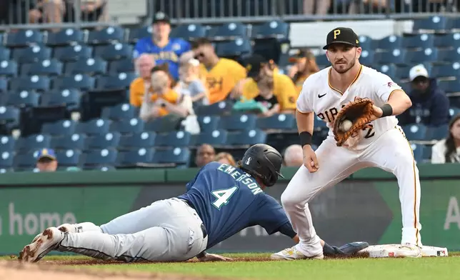 The Seattle Mariners' Colt Emerson (4) makes it back to first base safely as Pittsburgh Pirates first baseman Spencer Horwitz (2) catches the ball on a pick off attempt in the fifth inning of a baseball game, Tuesday, June 23, 2026, in Pittsburgh. (AP Photo/Philip G. Pavely)