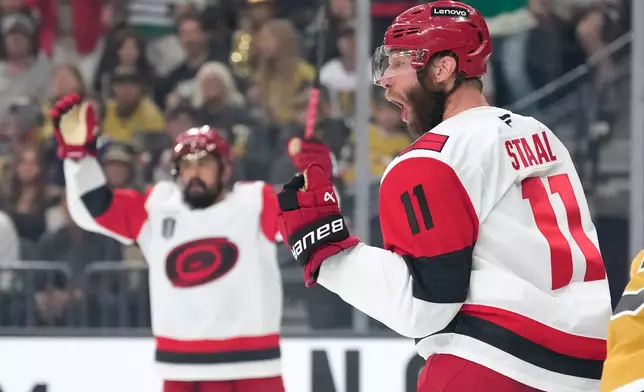 Carolina Hurricanes center Jordan Staal, right, celebrates his goal during the first period in Game 4 of the NHL hockey Stanley Cup Final series against the Vegas Golden Knights, Tuesday, June 9, 2026, in Las Vegas. (AP Photo/John Locher)