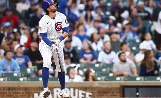 Chicago Cubs' Dansby Swanson watches his home run during the second inning of a baseball game against the Colorado Rockies in Chicago, Wednesday, June 17, 2026. (AP Photo/Jessie Alcheh)