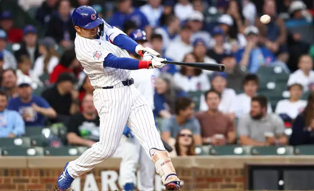 Chicago Cubs designated hitter Seiya Suzuki hits an RBI double during the second of a baseball game against the Colorado Rockies in Chicago, Wednesday, June 17, 2026. (AP Photo/Jessie Alcheh)