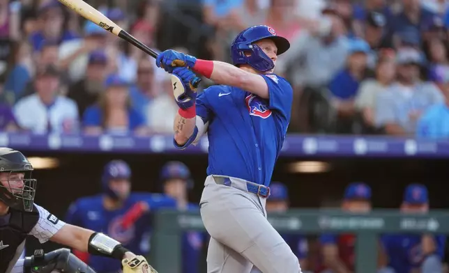 Chicago Cubs' Pete Crow-Armstrong follows the flight of his triple off Colorado Rockies starting pitcher Michael Lorenzen in the fourth inning of a baseball game Wednesday, June 10, 2026, in Denver. (AP Photo/David Zalubowski)
