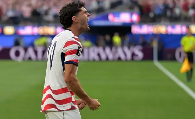 United States' Christian Pulisic celebrates after an own goal by Paraguay's Damian Bobadilla during the World Cup Group D soccer match in Inglewood, Calif., near Los Angeles, Friday, June 12, 2026. (AP Photo/Jayne Kamin-Oncea)