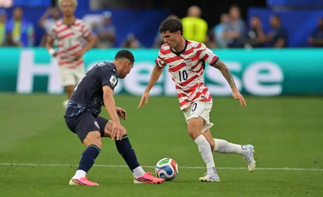 United States' Christian Pulisic (10) dribbles past Paraguay's Juan Jose Caceres during the World Cup Group D soccer match in Inglewood, Calif., near Los Angeles, Friday, June 12, 2026. (AP Photo/Jayne Kamin-Oncea)