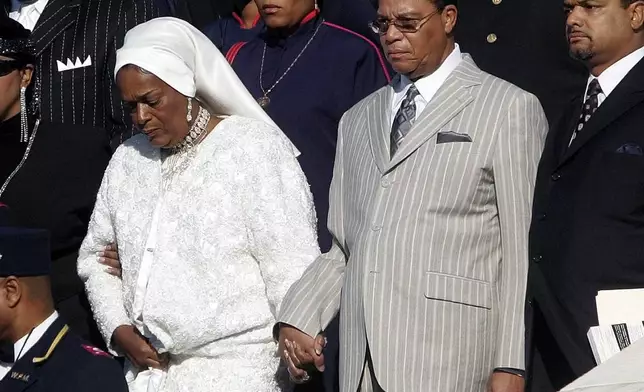 FILE - Nation of Islam leader Louis Farrakhan, center from Chicago, Il., walks down the steps of the Capital Building with his wife, Mother Khadijah Farrakhan, left, as they arrive at the Millions More Movement on the National Mall, Saturday, Oct. 15, 2005 in Washington. (AP Photo/Pablo Martinez Monsivais, File)
