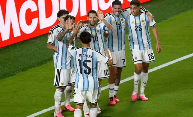 Argentina's Lionel Messi (10) celebrates with teammates after scoring their third goal during the World Cup Group J soccer match between Argentina and Algeria in Kansas City, Mo., Tuesday, June 16, 2026. (AP Photo/Reed Hoffmann)