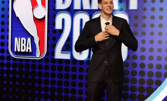 Hannes Steinbach arrives for the first round of the NBA basketball draft Tuesday, June 23, 2026, in New York. (AP Photo/Adam Hunger)
