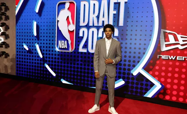Christian Anderson Jr. arrives for the first round of the NBA basketball draft Tuesday, June 23, 2026, in New York. (AP Photo/Adam Hunger)