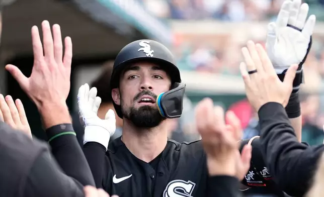 Chicago White Sox's Randal Grichuk (34) celebrates his home run against the Detroit Tigers during the first inning of a baseball game Friday, June 19, 2026, in Detroit. (AP Photo/Paul Sancya)