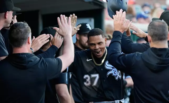Chicago White Sox's Junior Perez (37) celebrates his home run against the Detroit Tigers during the sixth inning of a baseball game Friday, June 19, 2026, in Detroit. (AP Photo/Paul Sancya)
