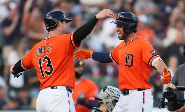Detroit Tigers Matt Vierling, right, celebrates his two-run home run with Dillon Dingler (13) against the Chicago White Sox during the first inning of a baseball game Friday, June 19, 2026, in Detroit. (AP Photo/Paul Sancya)