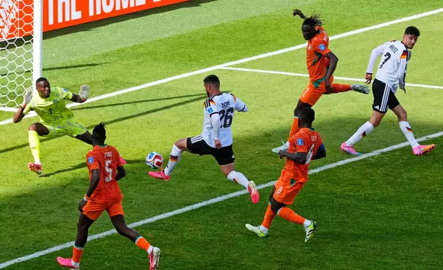 Germany's Deniz Undav (26) scores their first goal during the World Cup Group E soccer match between Germany and Ivory Coast in Toronto, Saturday, June 20, 2026. (Chris Young/The Canadian Press via AP)