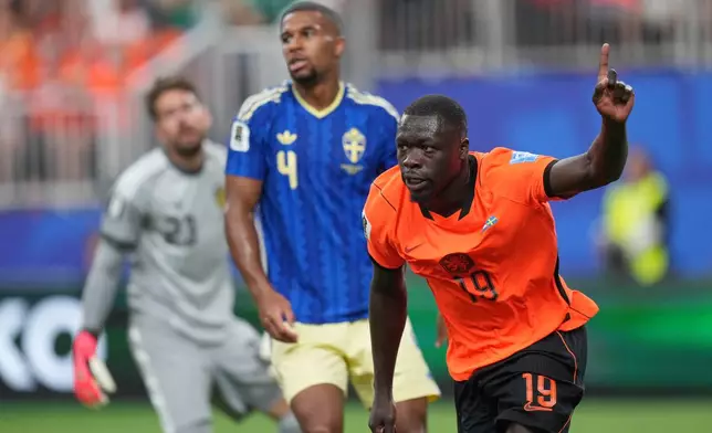 Netherlands' Brian Brobbey celebrates scoring his side's second goal against Sweden during a World Cup Group F soccer match in Houston, Saturday, June 20, 2026. (AP Photo/Eric Gay)
