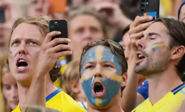 Sweden fans sing during the anthems ceremony prior to a World Cup Group F soccer match between the Netherlands and Sweden in Houston, Saturday, June 20, 2026. (AP Photo/Eric Gay)