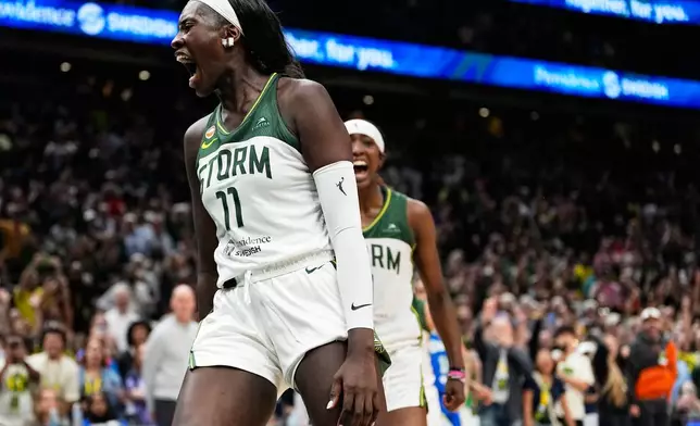 Seattle Storm center Awa Fam reacts after blocking Dallas Wings' Paige Bueckers at the basket during overtime in a WNBA basketball game, Monday, June 22, 2026, in Seattle. (AP Photo/Lindsey Wasson)