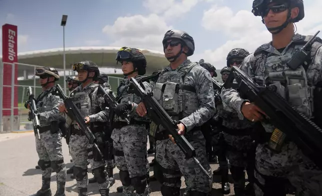 National Guard deploy outside the stadium that will host FIFA World Cup matches in Guadalajara, Mexico, Tuesday, June 9, 2026. (AP Photo/Matias Delacroix)