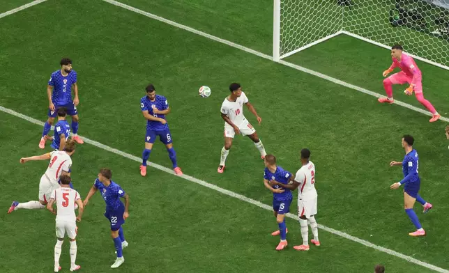 England's Harry Kane (9) scores during the World Cup Group L soccer match between England and Croatia in Arlington, Texas, near Dallas, Wednesday, June 17, 2026. (AP Photo/Sam Hodde)