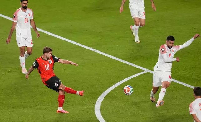 Austria's Romano Schmid scores his side's opening goal against Jordan during the World Cup Group J soccer match in Santa Clara, Calif., near San Francisco, Tuesday, June 16, 2026. (AP Photo/Jeff Chiu)